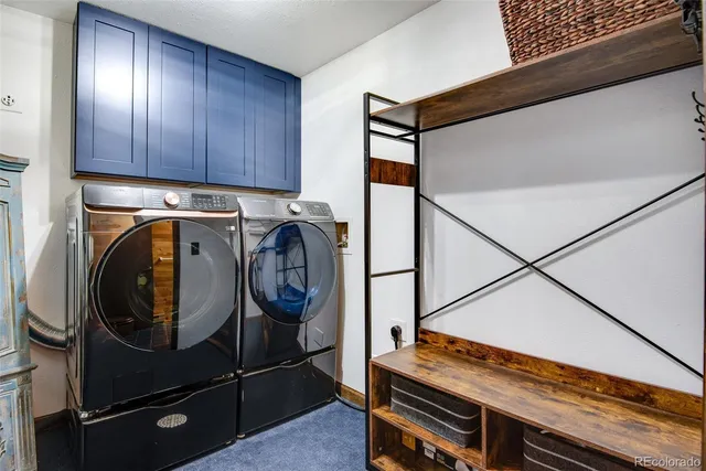 a view of a two chairs in the balcony