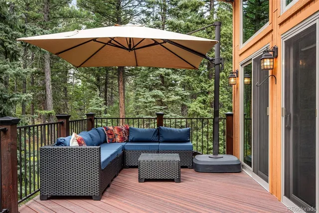 a view of sitting area with furniture and wooden deck