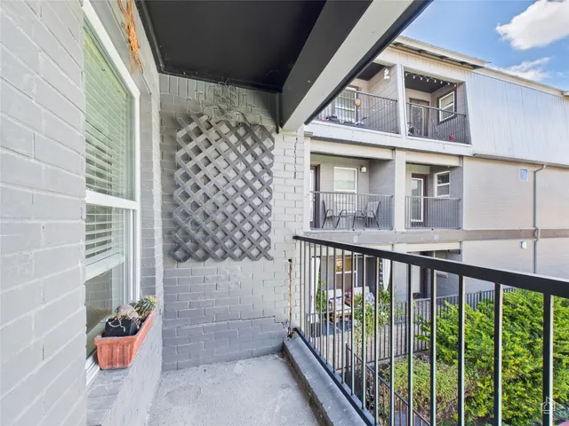 a view of a balcony with door