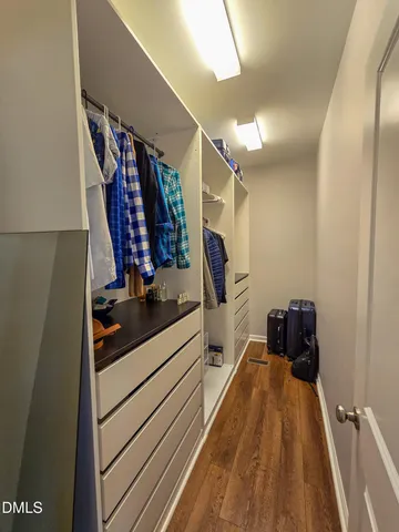 a view of a closet with storage