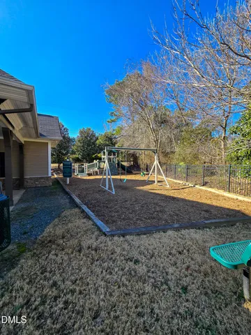 a view of a swimming pool with a lounge chair