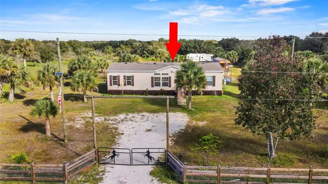 a view of a lake with a house in the background