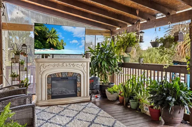 a bedroom with two beds and a large window with outer view