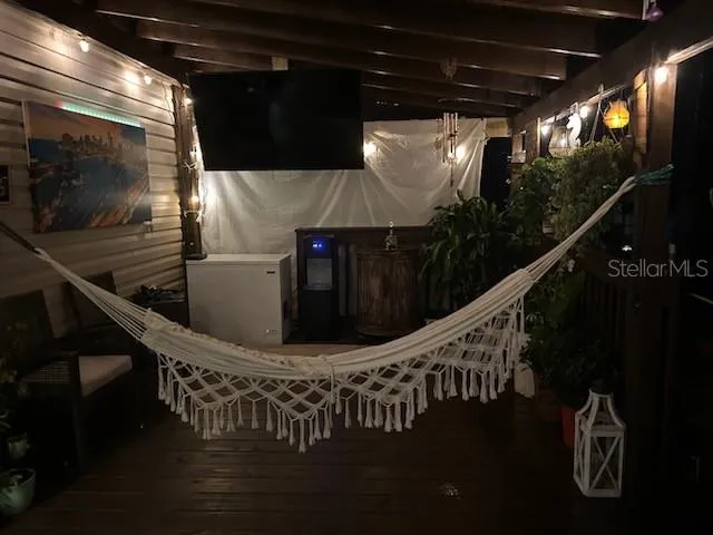 a kitchen with sink refrigerator dining table and chairs