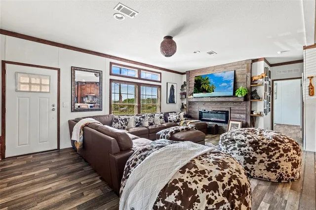 a bedroom with two beds and a fireplace