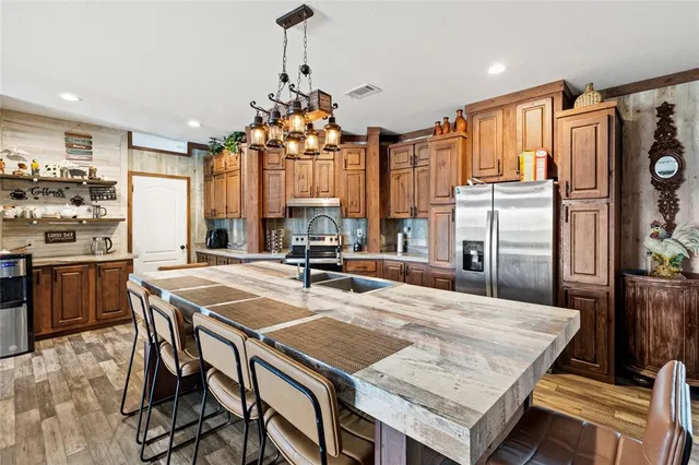 a living room with furniture and kitchen view
