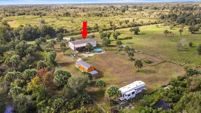 an aerial view of residential houses with outdoor space