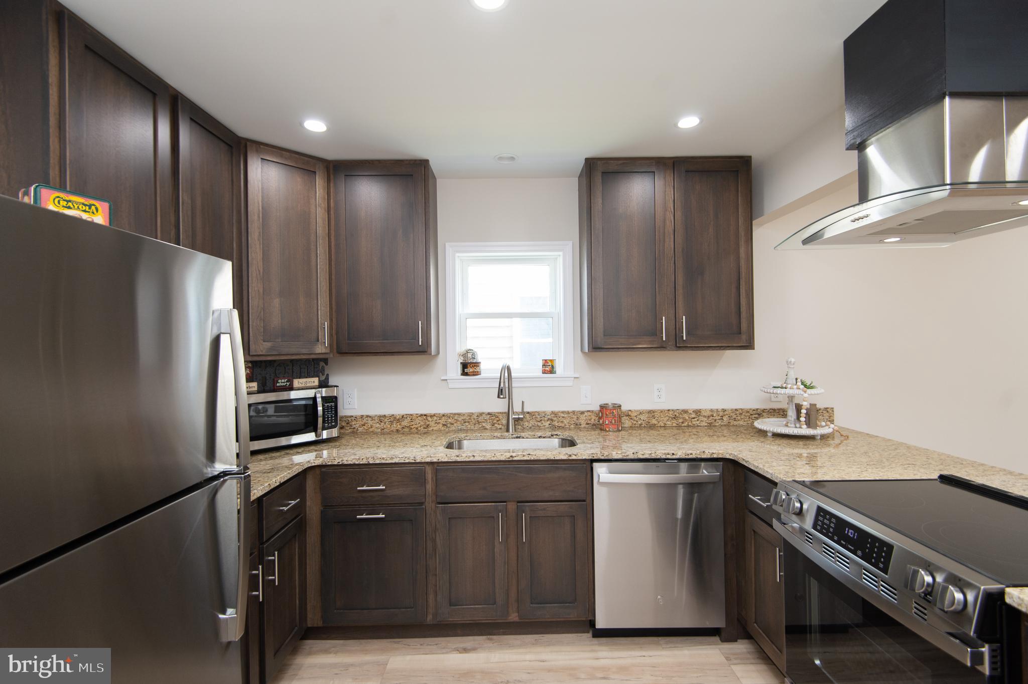 917 Springfield Avenue Cambridge, MD 21613 - Photo 13 of 42 a kitchen with a sink appliances and cabinets
