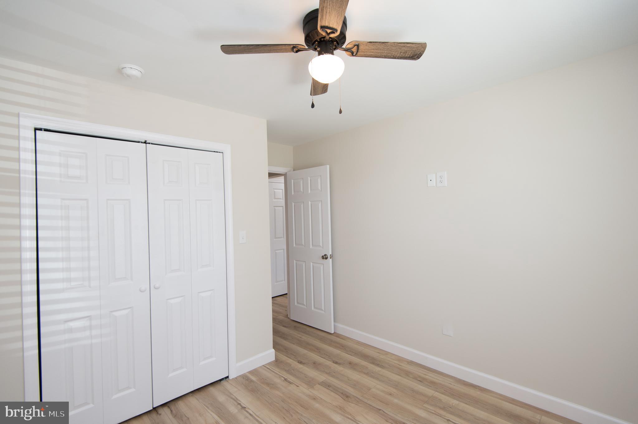 917 Springfield Avenue Cambridge, MD 21613 - Photo 19 of 42 a view of an empty room with wooden floor