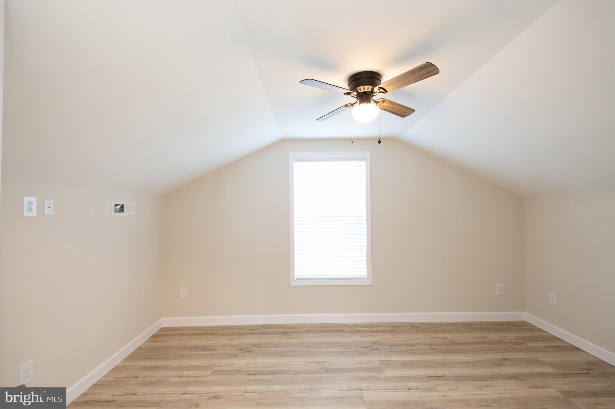 917 Springfield Avenue Cambridge, MD 21613 - Photo 31 of 42 a view of room with a ceiling fan and window