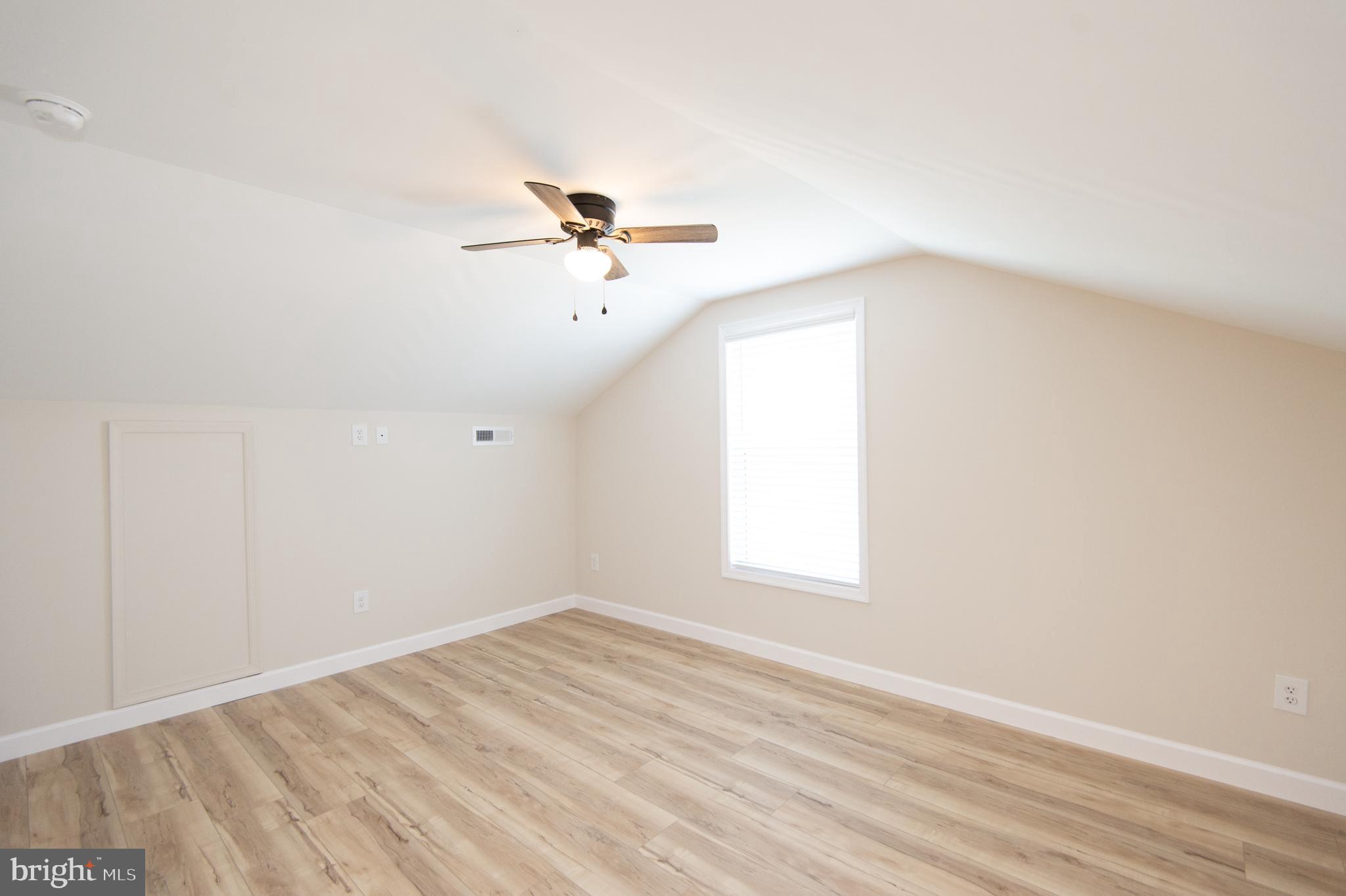 917 Springfield Avenue Cambridge, MD 21613 - Photo 35 of 42 an empty room with a window and ceiling fan