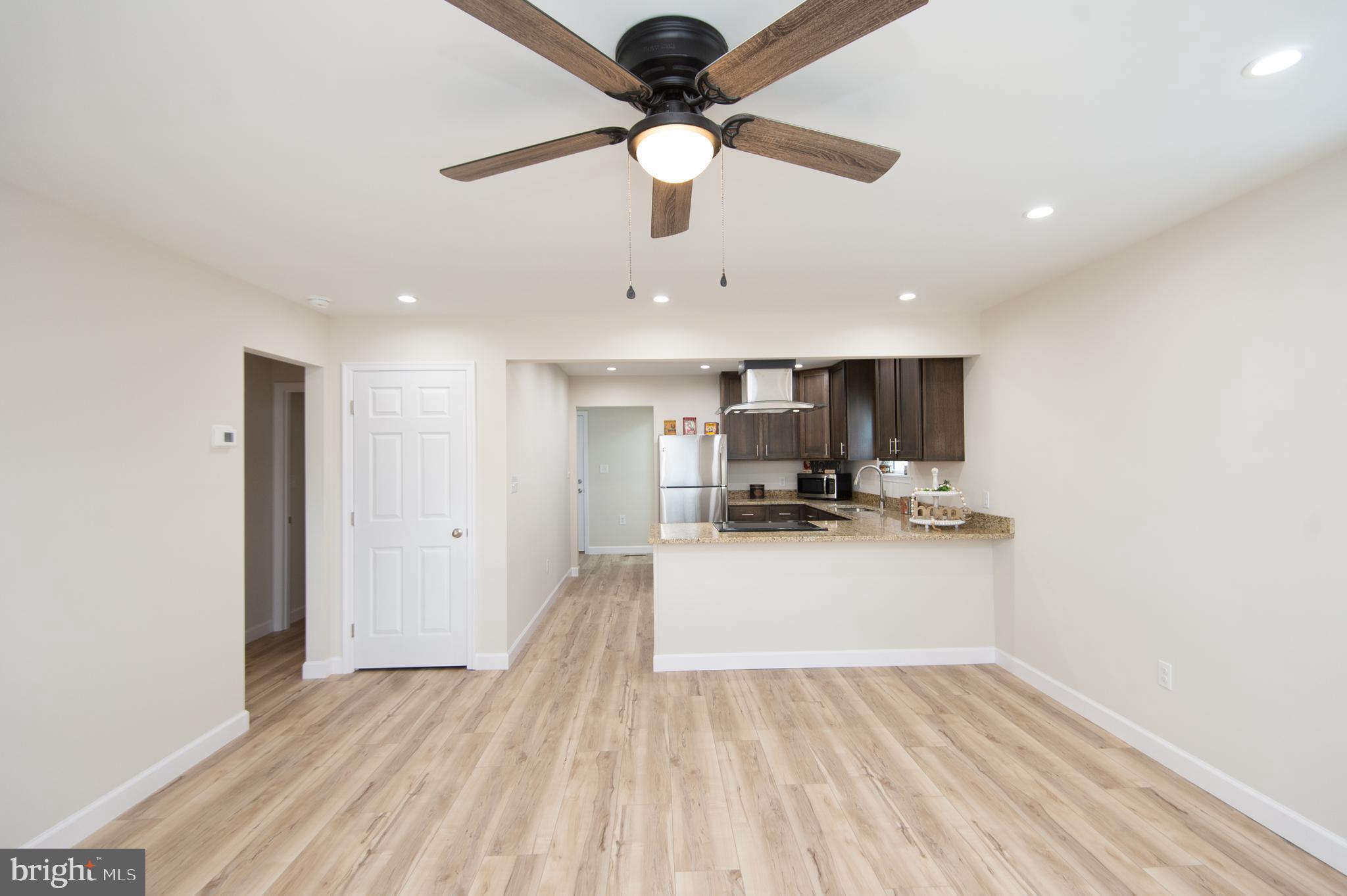 917 Springfield Avenue Cambridge, MD 21613 - Photo 7 of 42 a view of kitchen with sink microwave and cabinets