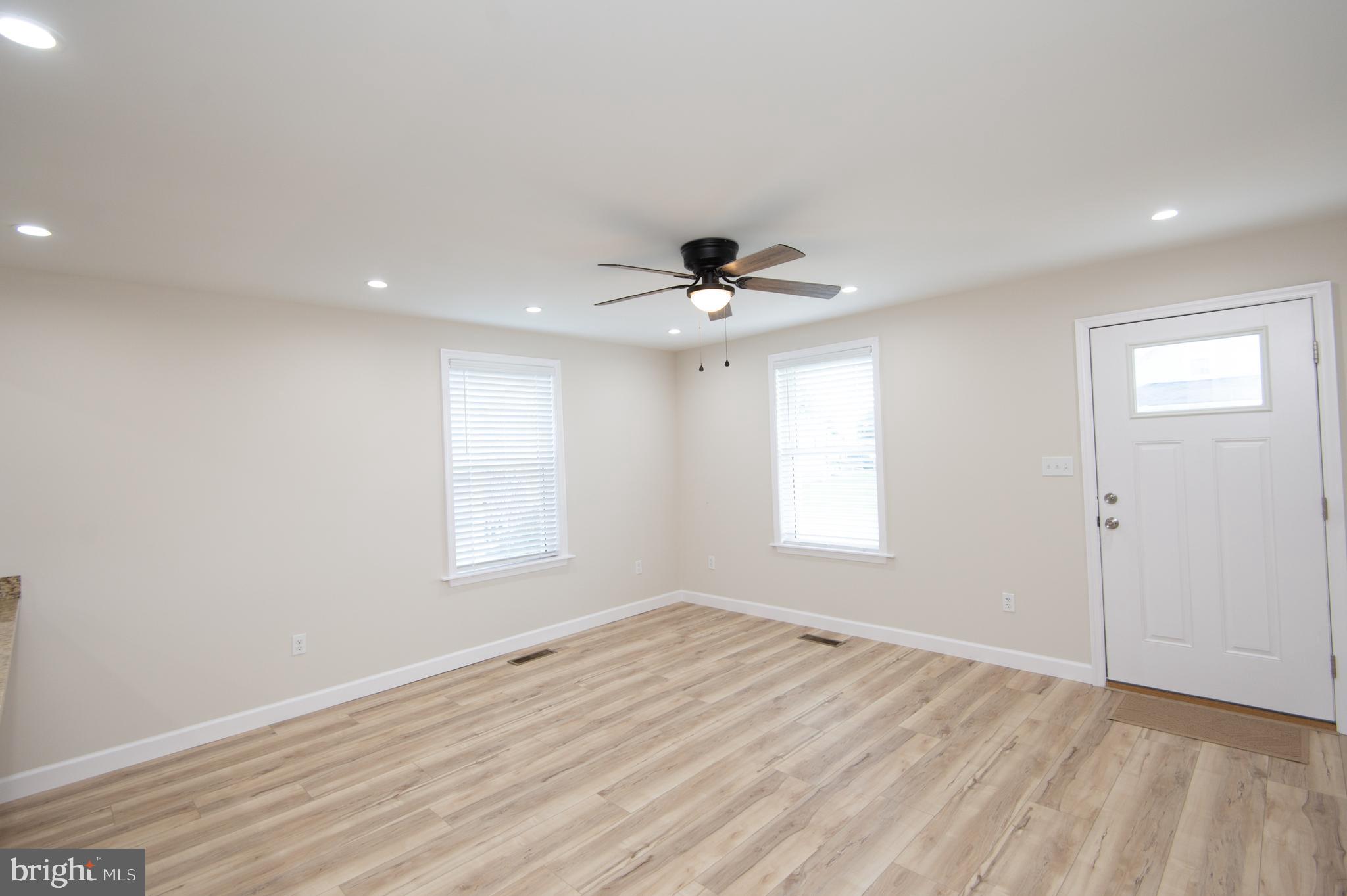 917 Springfield Avenue Cambridge, MD 21613 - Photo 10 of 42 a view of empty room with wooden floor and fan