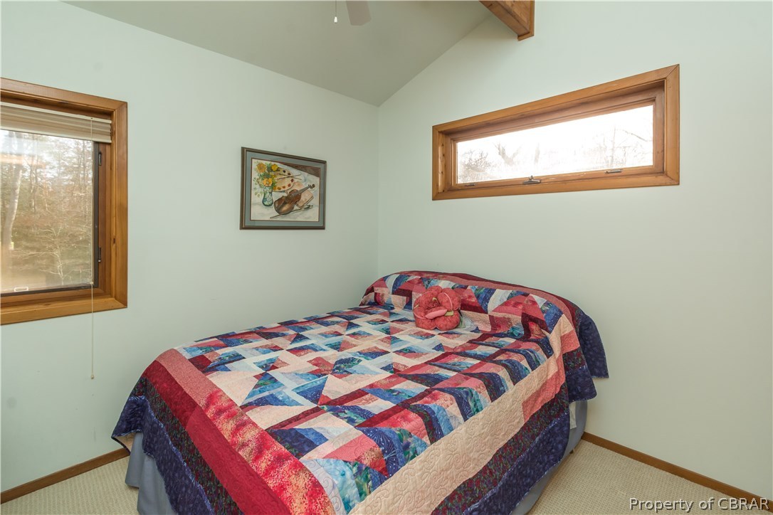 297 Cove Colony Road Lancaster, VA 22503 - Photo 30 of 50 a bedroom with a bed and a window