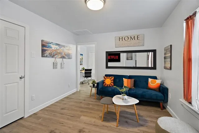 a room with furniture and a wooden floor