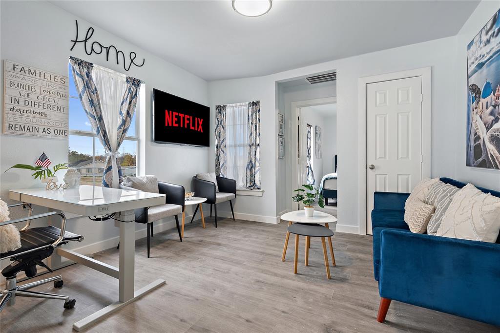 2308 Britton Avenue Dallas, TX 75216 - Photo 18 of 31 a living room with furniture and a flat screen tv