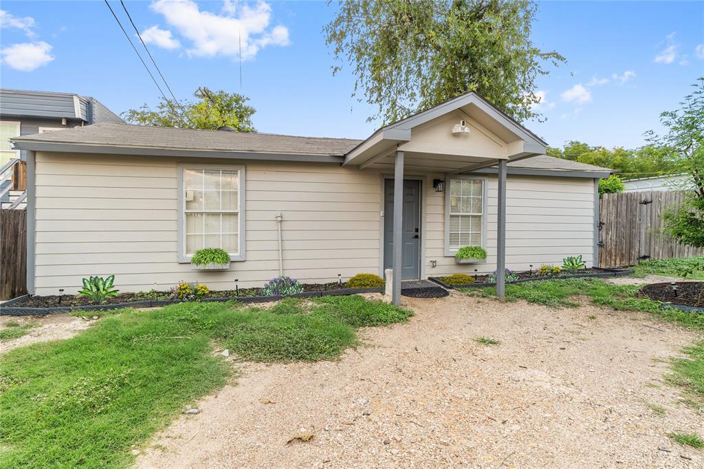 2308 Britton Avenue Dallas, TX 75216 - Photo 25 of 31 a front view of a house with a yard and garage