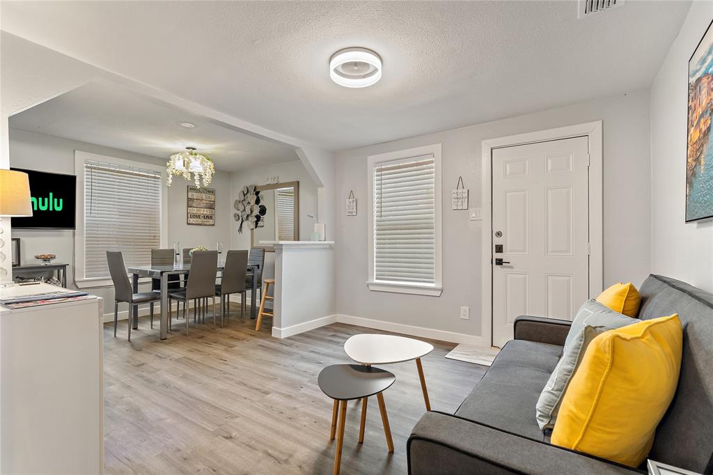 2308 Britton Avenue Dallas, TX 75216 - Photo 27 of 31 a living room with furniture and a window