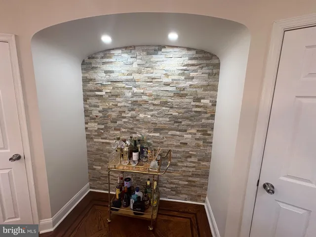 a room with water heater and wooden floor