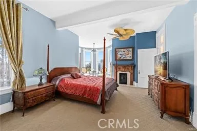 a bed room with a bed and a tv