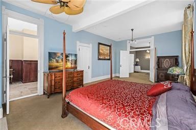 a bedroom with a bed and dresser