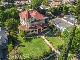 an aerial view of house with yard