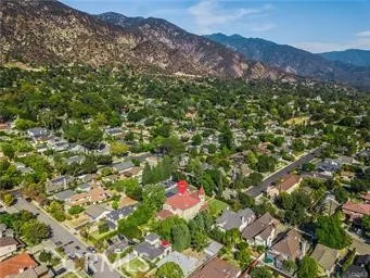 an aerial view of multiple houses with yard