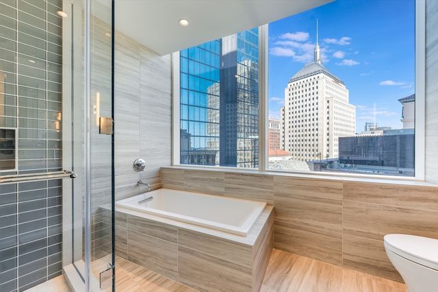 a bathroom with a bathtub and a shower