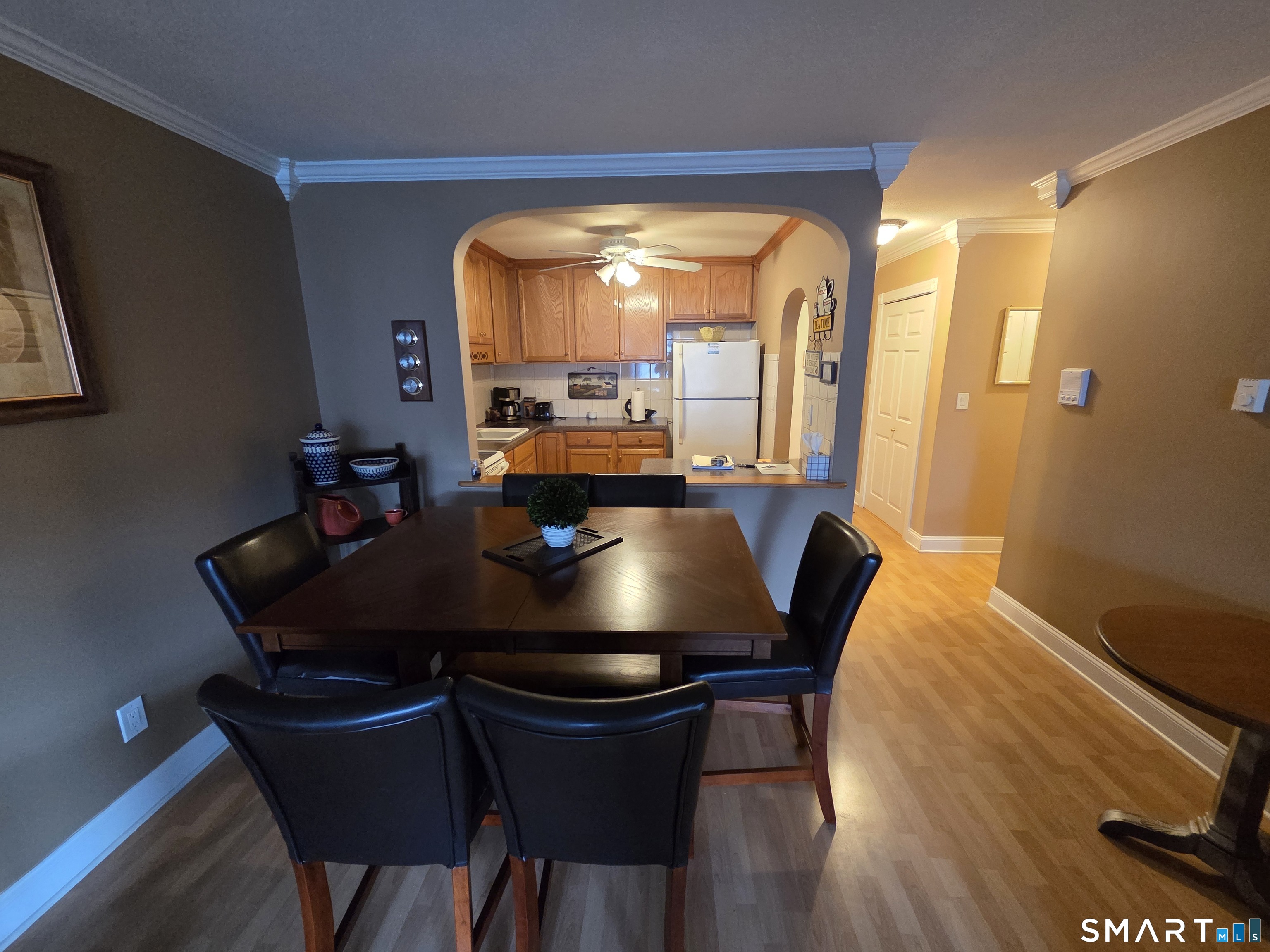 300 Meadowside Road, Unit 311 Milford, CT 06460 - Photo 3 of 7 a view of a dining room with furniture and wooden floor