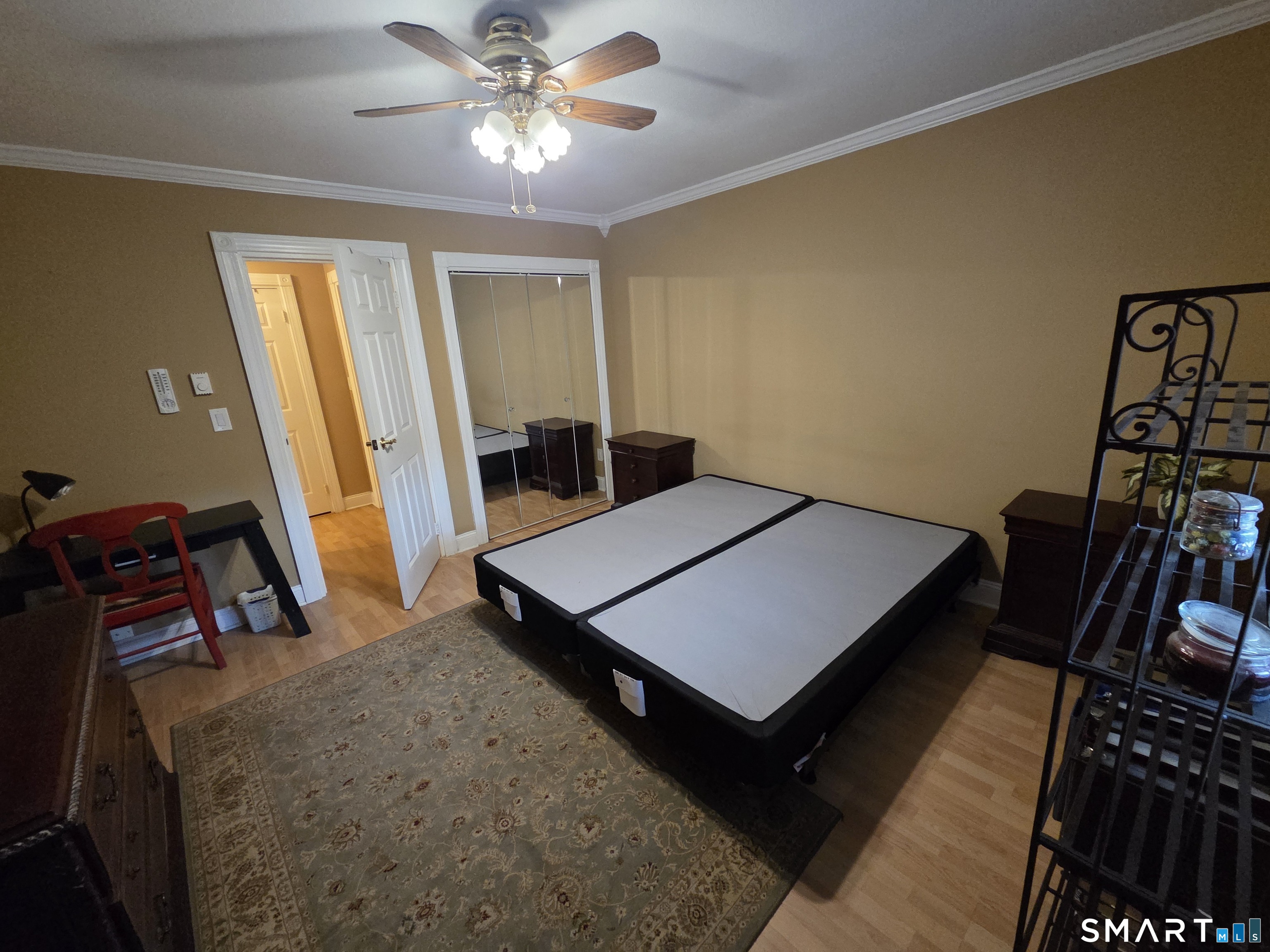 300 Meadowside Road, Unit 311 Milford, CT 06460 - Photo 4 of 7 a view of a room with furniture and wooden floor