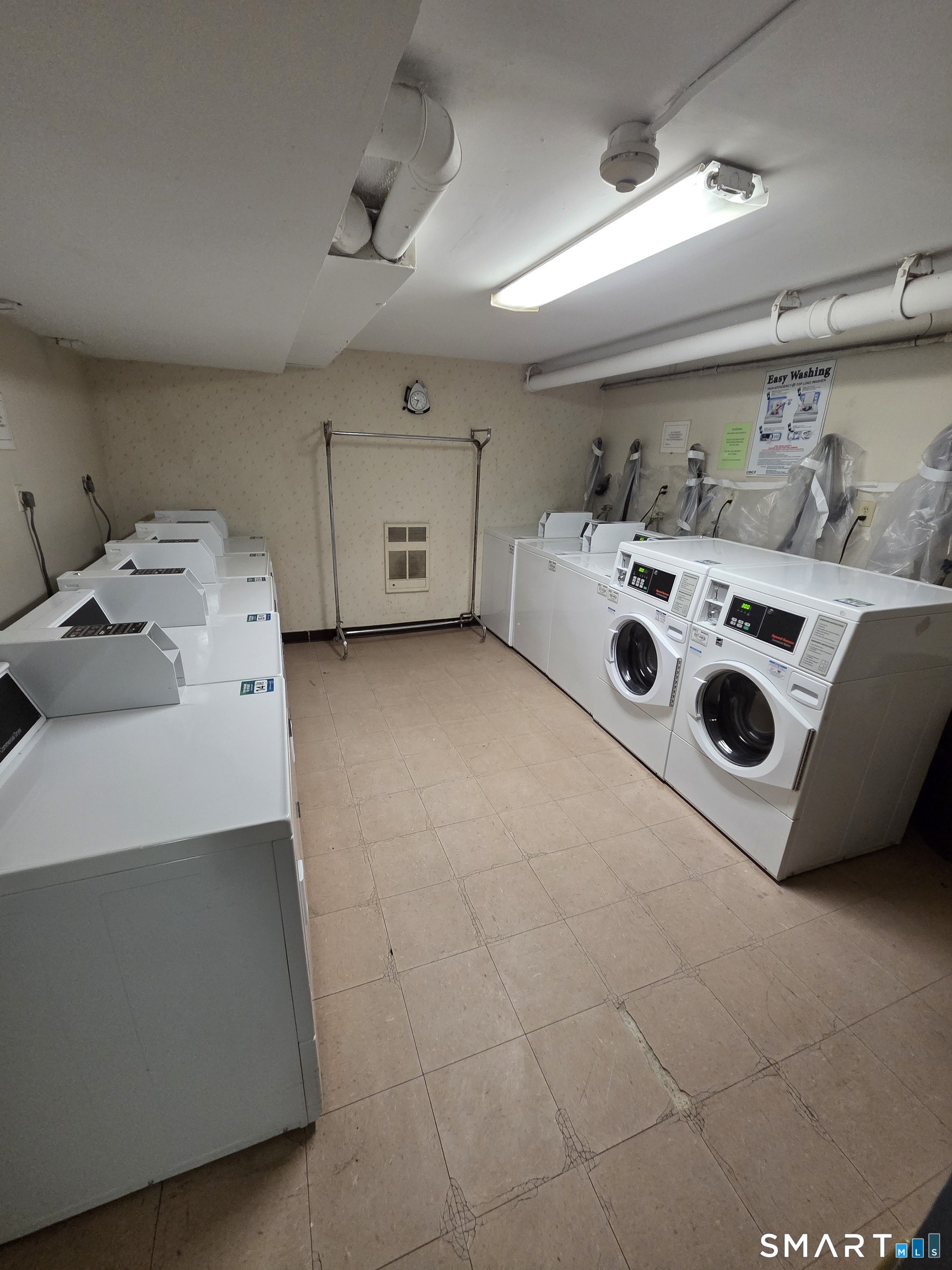 300 Meadowside Road, Unit 311 Milford, CT 06460 - Photo 7 of 7 a utility room with dryer and washer