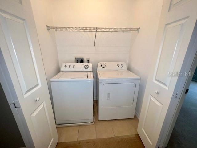 3896 Silverbell Loop Oviedo, FL 32765 - Photo 16 of 38 a utility room with dryer and washer