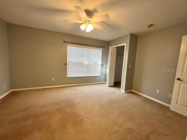 3896 Silverbell Loop Oviedo, FL 32765 - Photo 18 of 38 an empty room with windows and fan
