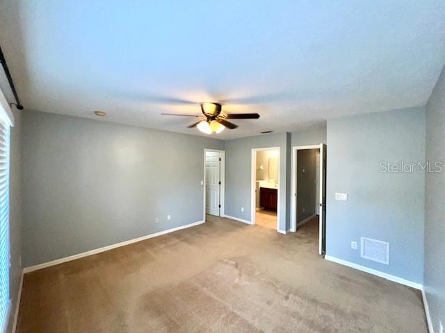 3896 Silverbell Loop Oviedo, FL 32765 - Photo 23 of 38 an empty room with closet and a chandelier fan