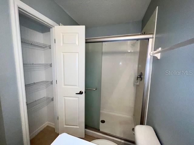 3896 Silverbell Loop Oviedo, FL 32765 - Photo 27 of 38 a bathroom with a shower and toilet