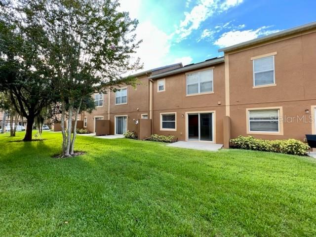 3896 Silverbell Loop Oviedo, FL 32765 - Photo 34 of 38 a view of a house with a yard