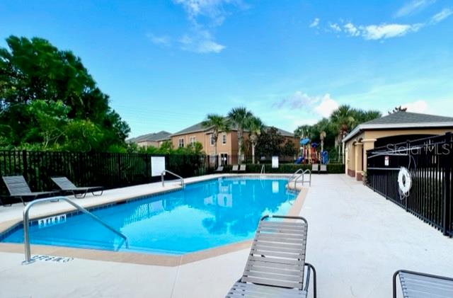 3896 Silverbell Loop Oviedo, FL 32765 - Photo 35 of 38 a view of a swimming pool with lounge chair