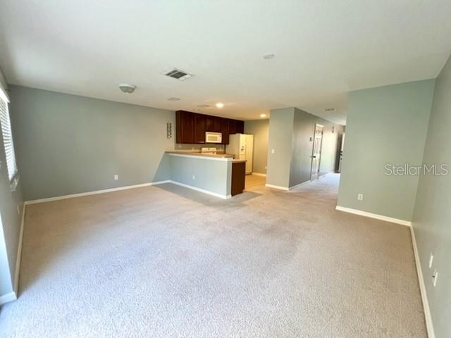 3896 Silverbell Loop Oviedo, FL 32765 - Photo 7 of 38 a view of a livingroom and a kitchen