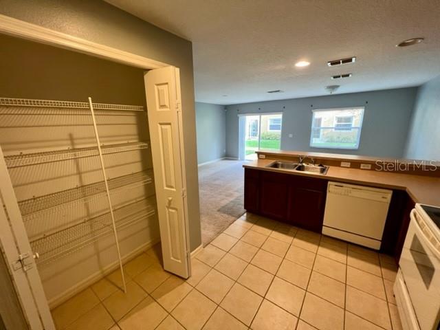 3896 Silverbell Loop Oviedo, FL 32765 - Photo 10 of 38 a kitchen with stainless steel appliances a sink and a refrigerator