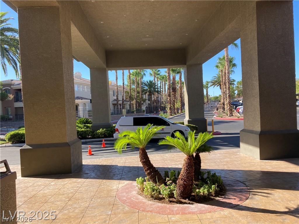 9050 West Warm Springs Road, Unit 1027 Las Vegas, NV 89148 - Photo 33 of 44 A grand covered entrance welcomes residents and guests to this tropical community.