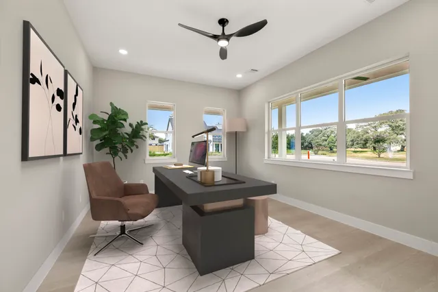 a bedroom with bed tv and window