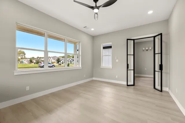 a kitchen with stainless steel appliances granite countertop a sink a stove and a refrigerator