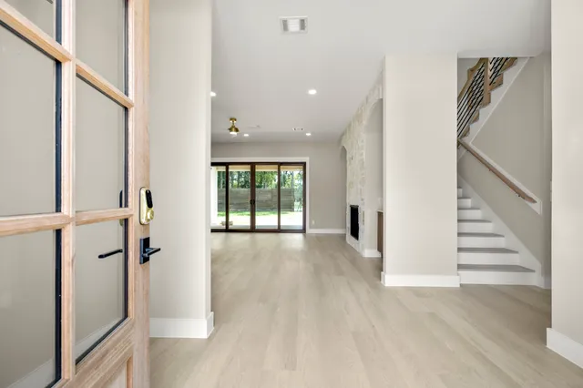 a view of entryway with wooden floor and stairs