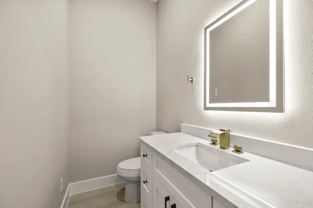 a view of a backyard with wooden fence