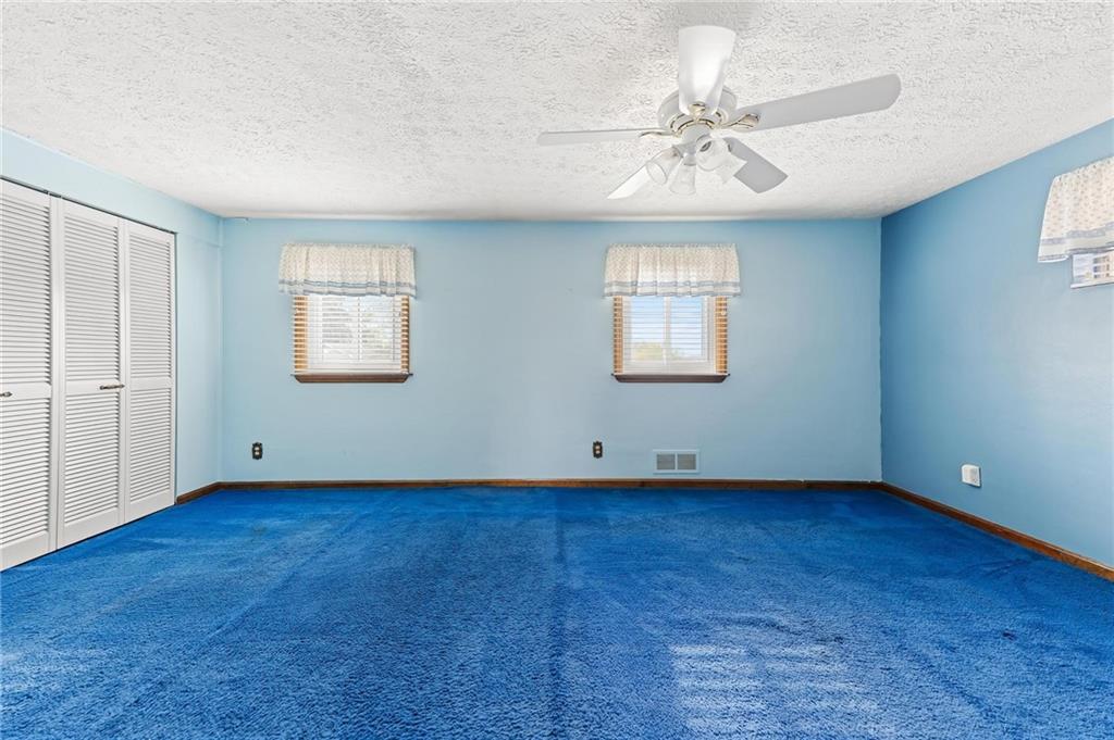 132 Shafer Road Moon Township, PA 15108 - Photo 7 of 15 a view of an empty room with window and wooden floor