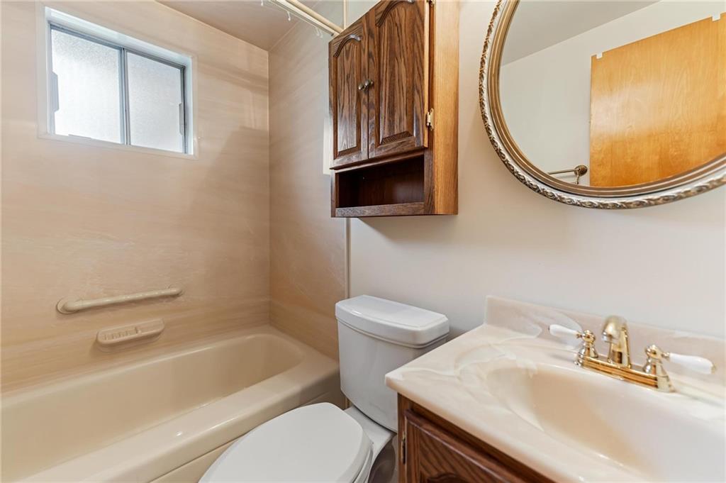 132 Shafer Road Moon Township, PA 15108 - Photo 9 of 15 a bathroom with a sink a toilet and a mirror