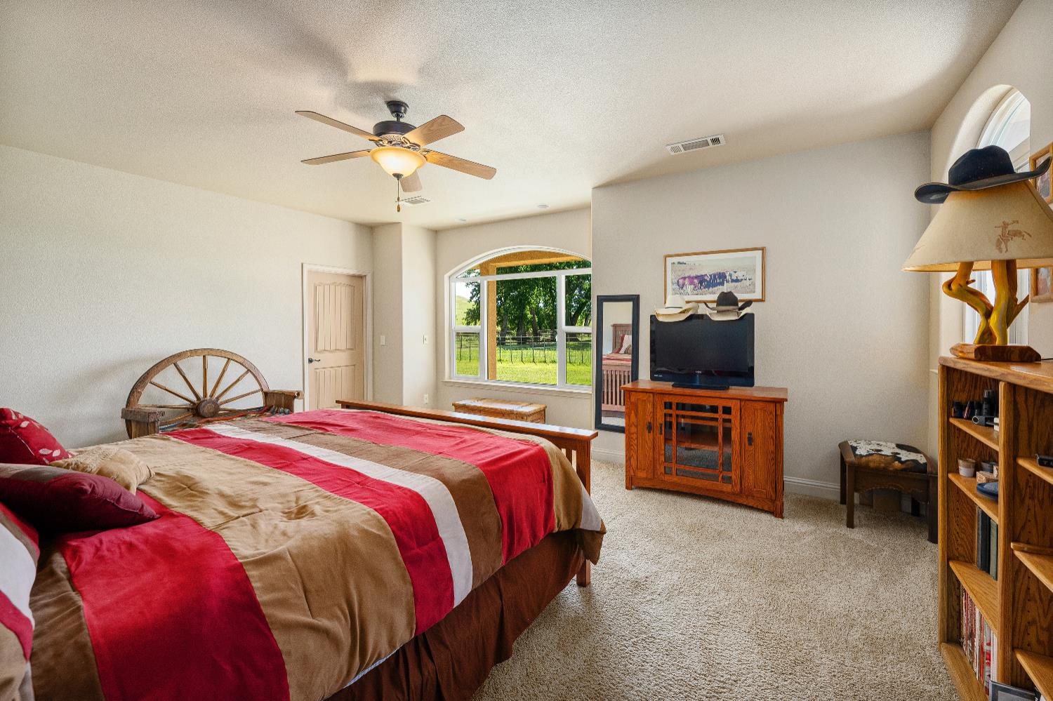 15605 Johnson Road Red Bluff, CA 96080 - Photo 21 of 88 a bedroom with bed a flat tv screen and dresser
