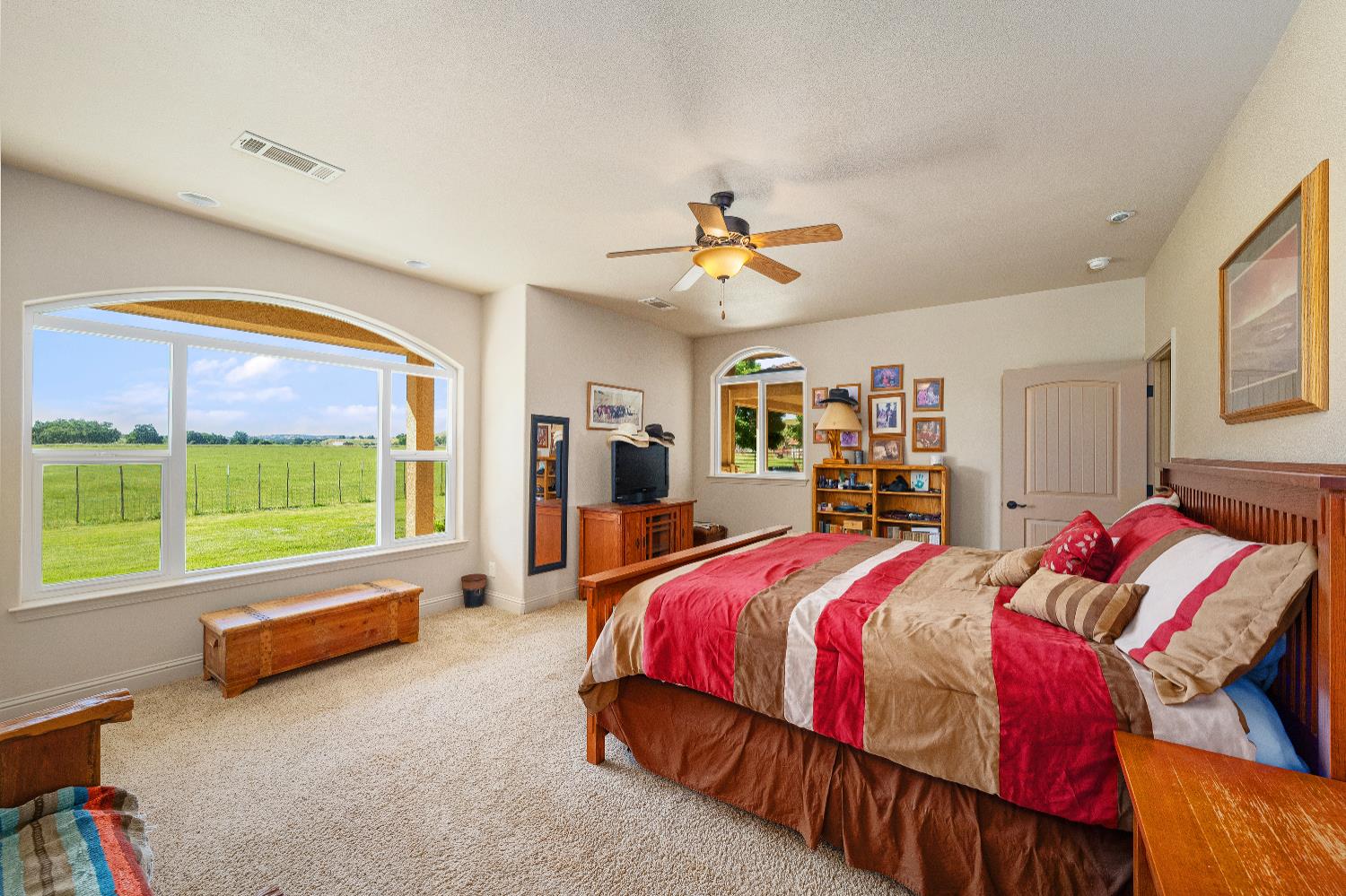 15605 Johnson Road Red Bluff, CA 96080 - Photo 22 of 88 a bedroom with a bed and a large window
