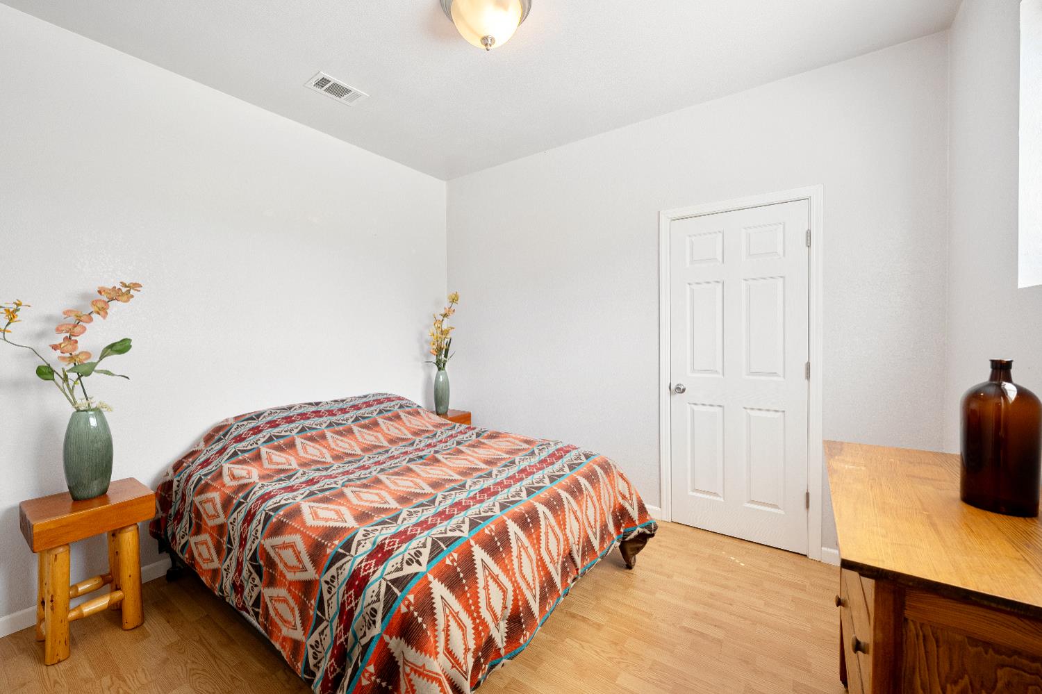 15605 Johnson Road Red Bluff, CA 96080 - Photo 38 of 88 a bedroom with a bed and a table in it