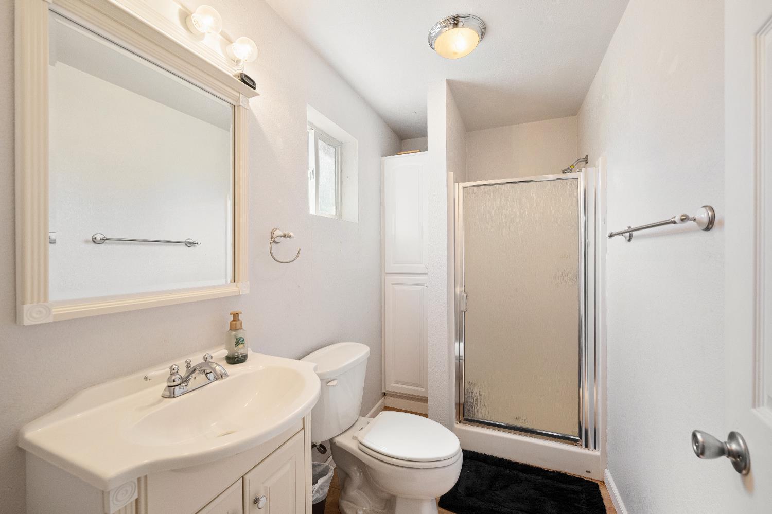 15605 Johnson Road Red Bluff, CA 96080 - Photo 39 of 88 a bathroom with a sink toilet and shower
